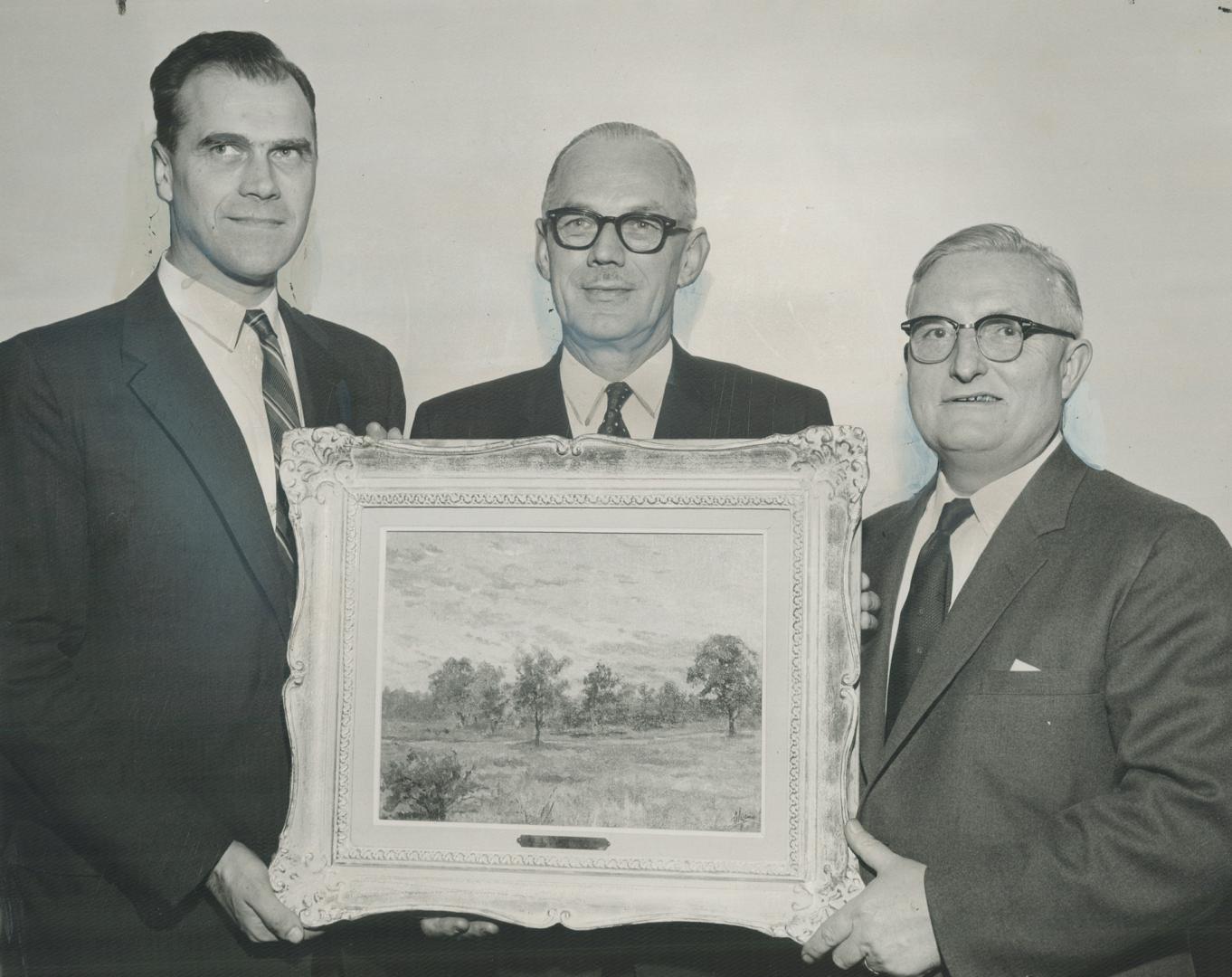 Tihom Hulikovsky, left, presents painting done by his mother, Grand Duchess Olga, sister of former Russian czar, to Ken Couson and Arthur Creighton, o(...)