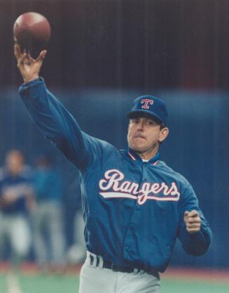 Texas Rangers pitcher Nolan Ryan, 44, who no-hit the Blue Jays last week -- a record seventh career no-hitter -- works out with a football at the SkyD(...)