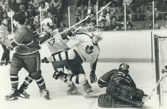 Darryl Sittler looks the other way as Borje Salming takes an unscheduled trip
