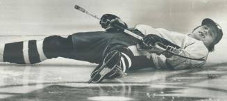 Borje Salming flashes toothless grin while stretching out on Gardens ice before starting exercise routine in preparation for tonight's game