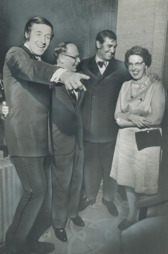 Rising stars Tony Sandler (left) and Ralph Young (second right) meet Mr