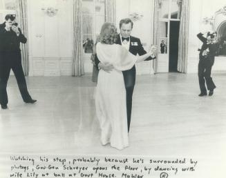 Watching his step, Governor-General Schreyer is first to lead off dancing with his wife, Lily, at a ball at Government House