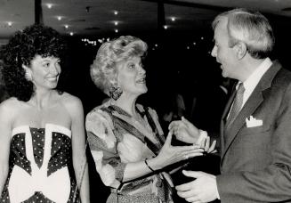 Above, Premier David Peterson greets Flare magazine publisher Donna Scott, while Jori Kadlec looks on