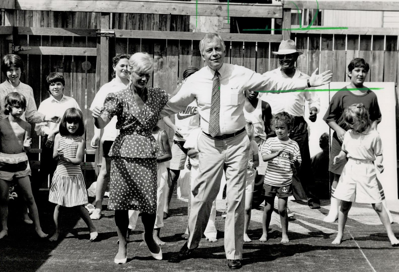 Culture Minister Lily Munro and Attorney-General Ian Scott join youngsters in a dance after announcing a $241,488 grant for the Cabbagetown Community (...)