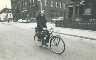 Cyclists--including Mayor John Sewell, above, no doubt-- are plagued by manholes and sewers, reader says