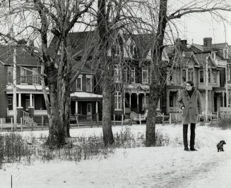 Alderman John Sewell walks his dog at the Shutter and Sherbourne St