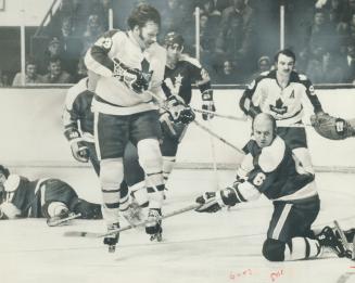 Creating Havog in front of Minnesota North Stars' goal is Maple Leafs' irrepressible Eddie Shack (23), who earned star rating for his performace in te(...)