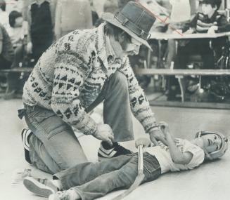 Clear the track -- here comes Shack! The annual broomball game between the Easter Seal Moppets form the Ontario Crippled Children's Centre on Rumsey R(...)