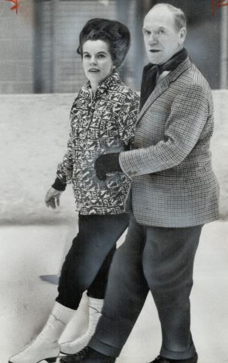Sharp on ice. Minister Sharp skates with Marcia Moss toy given by him and three other Liberal MPs Sat-night. Dancing and entertainment followed