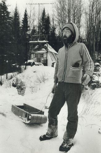 The quiet life: Dallas Bader stands in front of his tepee-shaped cabin beside the beaver meadow.