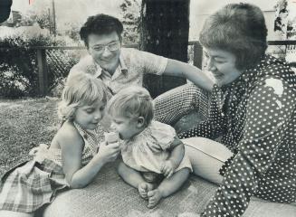 Michael Barrett, Chairman of the Sex Information and Education Council of Canada, here with his wife, Ann, and children, Heather and Andrea, says parents may have reservations about sex book Show Me, but they should be able to decide for themselves if it is appropriate.
