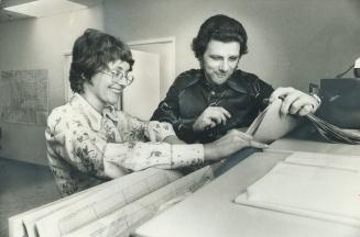 Out in the Suburbs, the National Parole Service takes its work to its customers, many of whom are white-collar criminals. Here parole officer Ray Belcourt and assistant district supervisor Yvonne Mason check files in North York.
