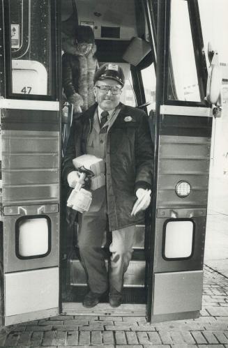 That's it folks: 'Nitty' Joe Bergin, a driver for 33 years, steps out of his Gray Coach bus for the last time yesterday.