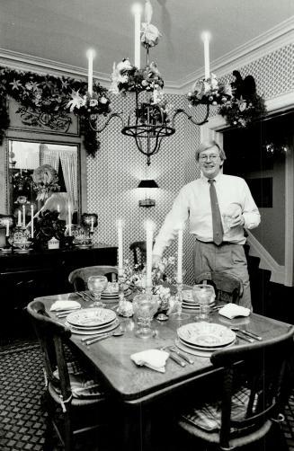 Designer Harold Babcock decorates his home for Christmas with fresh holly and natural wreaths with flowers added. He also uses great swags of fresh-smelling greenery decorated with clear lights