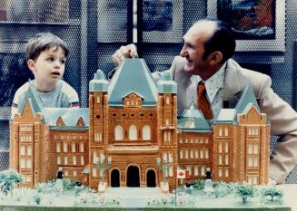 Tribute to Toronto: Henry Balaban, of North York, shows his model of Queen's Park to 4-year-old Steven Makrinos at Fairview library. The model, made of plaster and sheet metal, is on display at the library until Nov. 15, when it will be donated to the Legislature.