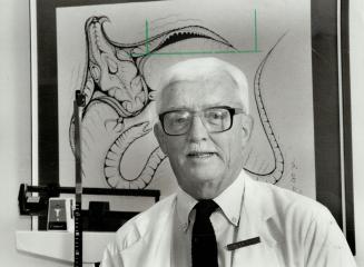 In front of the native art he loves is Dr. Harry Bain, professor emeritus of pediatrics at the U of T and Hospital for Sick Children, who received an award last week for promoting the quality of family life.