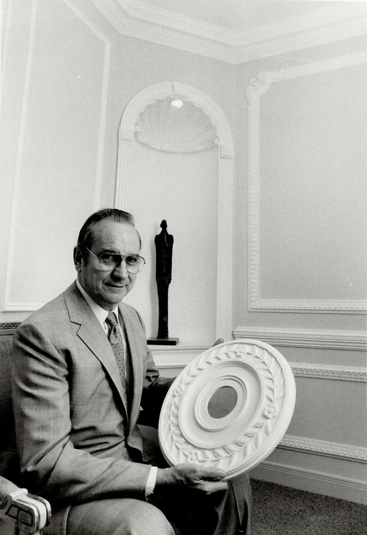 Artistic touch: People are tired of the hospital corridor look, says Wilf Balmer of Balmer Architectural Art, holding a ceiling centrepiece.