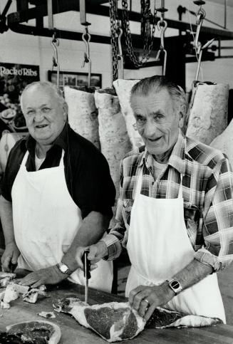 Like old times: Joe (left) and Wilbur Barkey carry on a tradition of three generations, smoking meats and cheeses and selling meat in their butcher shop.