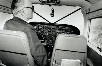 Bullder John Boddy likes to keep tabs on his developments from his own float plane, at left. Model home, below, is in his Forest Brook Estates, an enclave of 48 large lots backing on to a wooded ravine in Pickering.