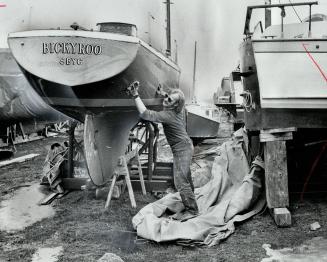 Launching his sailing season, Robert Beattie vigorously polishes the hull of his sailboat at Port Credit as he readies it for the water. In the Metro area, there'll be some boats out on Sunday, with light winds and a high of 60.