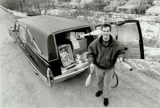 Lively Wares from a Hearse, Darren Bedford displays Juggling equipment he sells from his 1968 Cadillac which carries the licence plate Grusim.