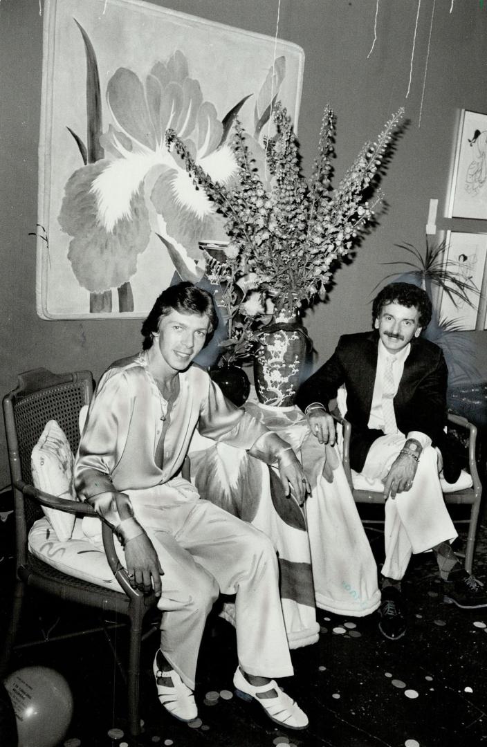 Elegant setting: Toronto party co-ordinator Van Beltrame (right) and artist Jack Thurling make use of green lacquer bamboo armchairs at Van Beltrame's Richmond St. Showroom.