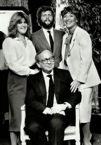 Family team: Russell, Berg, who began working with his father, Ira, at age 15, is surrounded by son, Michael, wife, Noreen right, and daughter, Susan.