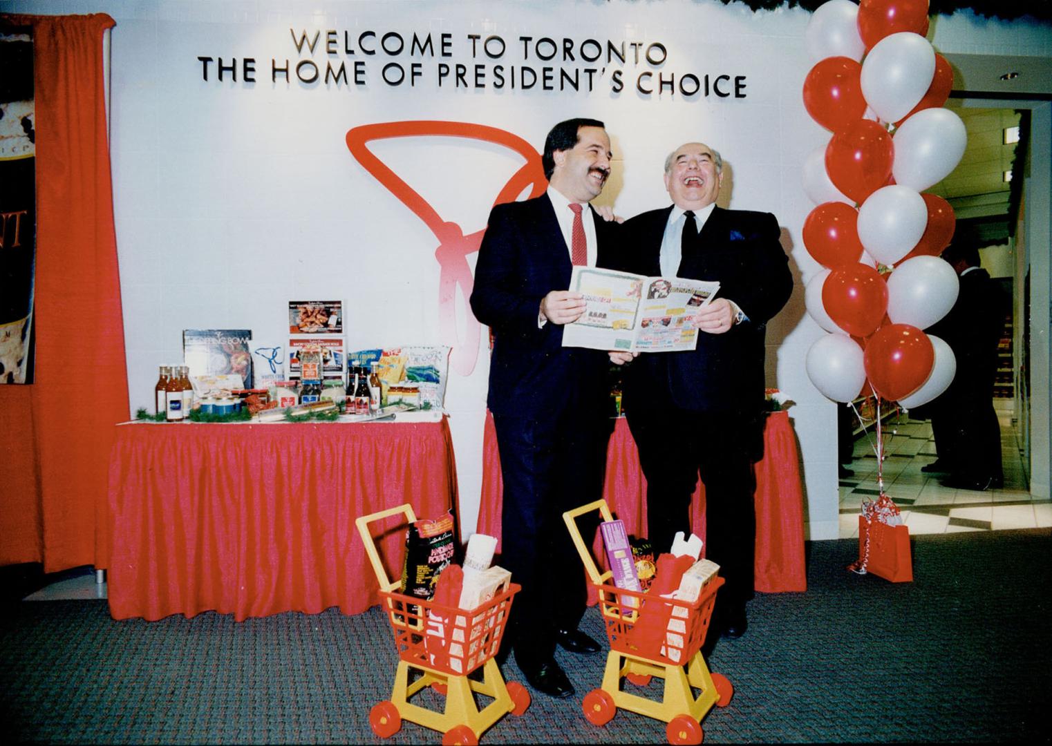 Thomas Bitove (left), and Loblaws' Brian Davidson invite airline passengers to land in new market at Pearson International.