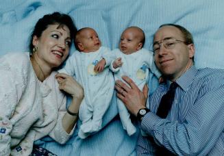 Safe and sound: Deanne and David Brandt at home with twins Andrew and Graeme.