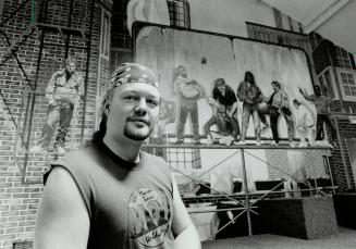 Bright Future: Mission counsellor Rob Bright, 26, a former street kid, stands before a mural and stage where Christian rock bands perform for homeless teens at the Evergreen Drop in Centre on Yonge St.