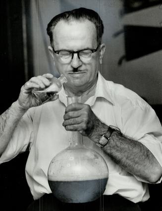 Kenneth Burnett, shown mixing one of his special luminous formulas, wants to sell the business which has saturated most of his 70 years in imitation glamor. He has spent most of his life creating new uses for glowing paints.