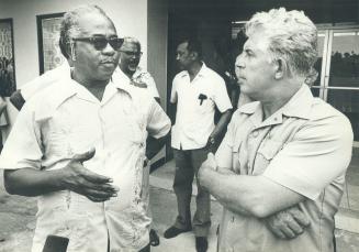 St. Vincent premier milton CATO (left) confers with Allan Roger, Canadian High Commissioner to Barbatos Soufiere volcano