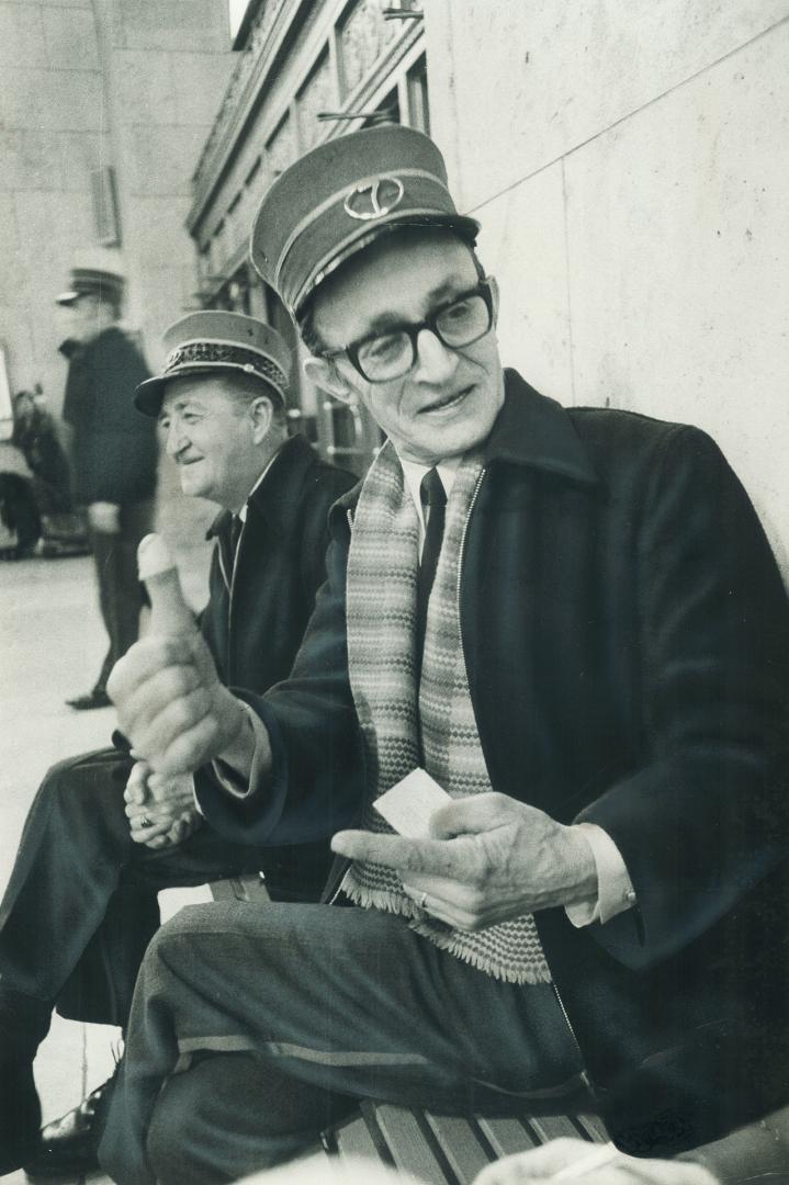 Toronto's oldest Redcap, Jake Charendoff, sits waiting for new business at Toronto's Union Station, while behind him sits redcap Bert Fortune. Charendoff picked up his first piece of baggage at Union Station on the day it opened in 1927. But, although he claims the title oldest, he refuses to say exactly how old he is.