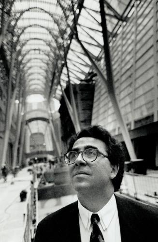 Spanish architect/engineer/sculptor Santiago Calatrava checks the progress of the magnificent steel and glass canopy he designed for the Galleria at BCE Place.