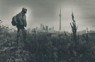 No shelter: For many of the poor, like Michael Crandall, the city is just a skyline, providing no home.