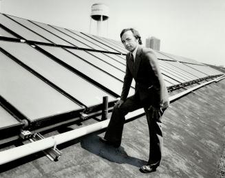 Hot new idea: Rock Cameron, manager of engineering at Christie Brown and Co. Ltd., stands on the solar-panelled roof of the company's Lakeshore Blvd. plant, where the solar heating system is expected to save $4,000 a year on heating costs.