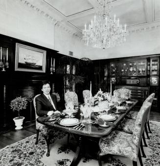 Interior designer Joseph Cheng outfitted the elegant dining room with fine antique furnishings.