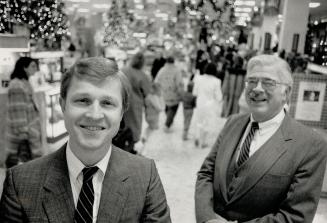 Master planners: Harold Chmara, left, and Ted Hall are planning how Th Hudon's Bay Co. will implement the new federal sales tax throughout its retailing empire, including the flagship Simpsons store in down town Toronto, where 100 cas registers must be repogrammed.