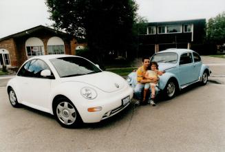 Twice the fun: Ken Christofi, owner of Toronto's Bauhaus night club and seen here with niece Tanna, 3, had his 1974. Beetle painted VW Bug blue (it was white), the same colour as the VW his father had when Christofi was a boy in Cyprus. His New Beetle, a turbodiesel model, is white. Chriscofi admits he loves the bells and whistles and comfort of the '90s remake.