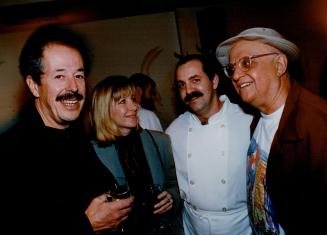 Director denys Arcand, Denise Robert, chef Michel Lombardi and dinner host George Christy enjoy each other's company at Trattoria Mezza Luna Sunday night.