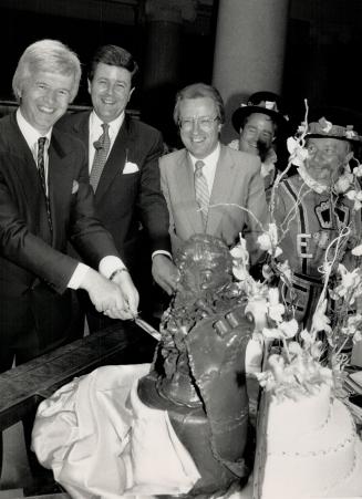 Fit for a king: James Batt, left, Lord Charles Spencer Churchill and Mayor Art Eggleton tuck into an edible bust of Edward VII to mark the 85th birthday of his namesake hotel.