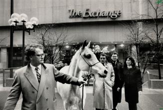 Straight from the Horse's mouth. A.K. Nouara, a straight Egyptian mare, posed before the Toronto Stock Exchange yesterday to publicize the listing of Stonebridge Inc., the first horsebreeder to be listed on the exchange. Accompanying the horse are executives of the company (left to right): Mark Coles, Kim Gladwish, Gordon Coles and Maryelien Coles.