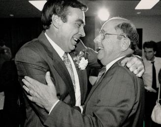 Happy Tories: John Cole, the last-minute candidate who defeated Liberal Frank Stronach, is congratulated by incumbent MP Sinclair Stevens, who had to withdraw after Prime Minister Brian Mulroney refused to sign his papers.