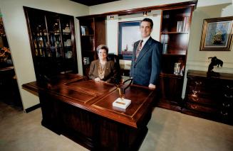 Prize winners: Leda and Lino Confalone of Woodbridge pose with their award winning desk set at the Torotno Furniture Market trade show being held this week in Mississauga.