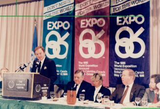 Drumming up business: Mel Cooper, a radio station owner in Victoria in change of getting corporate sponsors for Vancouver's Expo 86, speaks to the Broadcast Executives Society at the Sheraton Centre. Sitting to his left are Society president Michael Kennerley and director Marge Anthony.