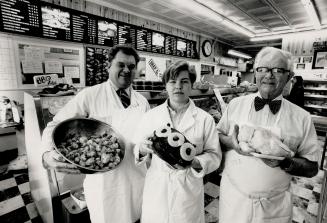 The Cowiesons: Brian, left, runs Cowleso's Meats, on Yonge St. With him are Jennifer,18, dad, Gordon, who opened store in 1939.
