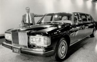 Riding high: John Cox, owner of a Toronto luxury-car dealership, displays one of his brisk-selling Rolls-Royces. He settled in Canada after his British boss wouldn't promote him to salesman because of his Cockney accent.