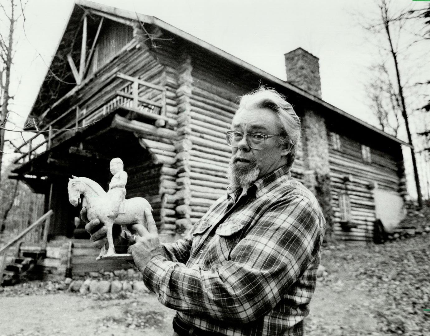 Frank Crane: The opera singer turned antique dealer was tired of the urban jungle so he retreated into the woods with his wife, Verena, and built himself a log cabin. And you can see the cabin Frank built! It's cathedral sized. Just the thing for housing such treasures as the Chinese tomb figure from the T'ang period (618 to 906 A.D.) which he is holding. These things are on trust, he says.