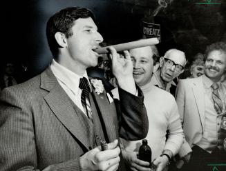 Victory bash: MPP Sam Cureatz (PC-Durham East joins the boys for a little victory celebration after winning a second term at Queen's Park with a 6500-vote margin over his nearest rival. Th party was held at an industrial mall in North Oshawa and Cureatz showed up in grey pinstripe.