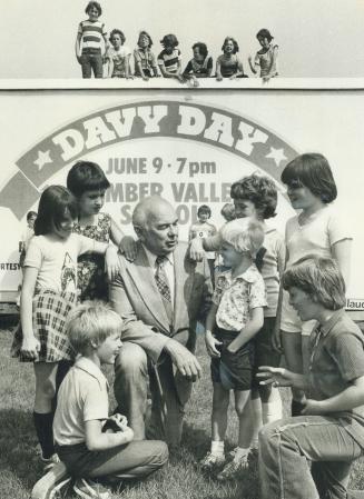 Principal attraction: After 41 years as an educator, Jack Davy is retiring this month as principal of Humber Valley Village Junior-Middle School. Community has planned a huge reception for him today, starting at 7 p.m. in the school. He chats with admirers in front of special billboard.